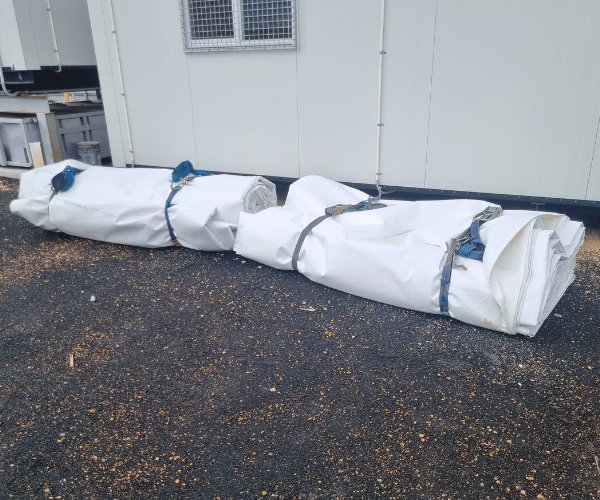 Fabric covers from industrial dome shelter ready for relocation